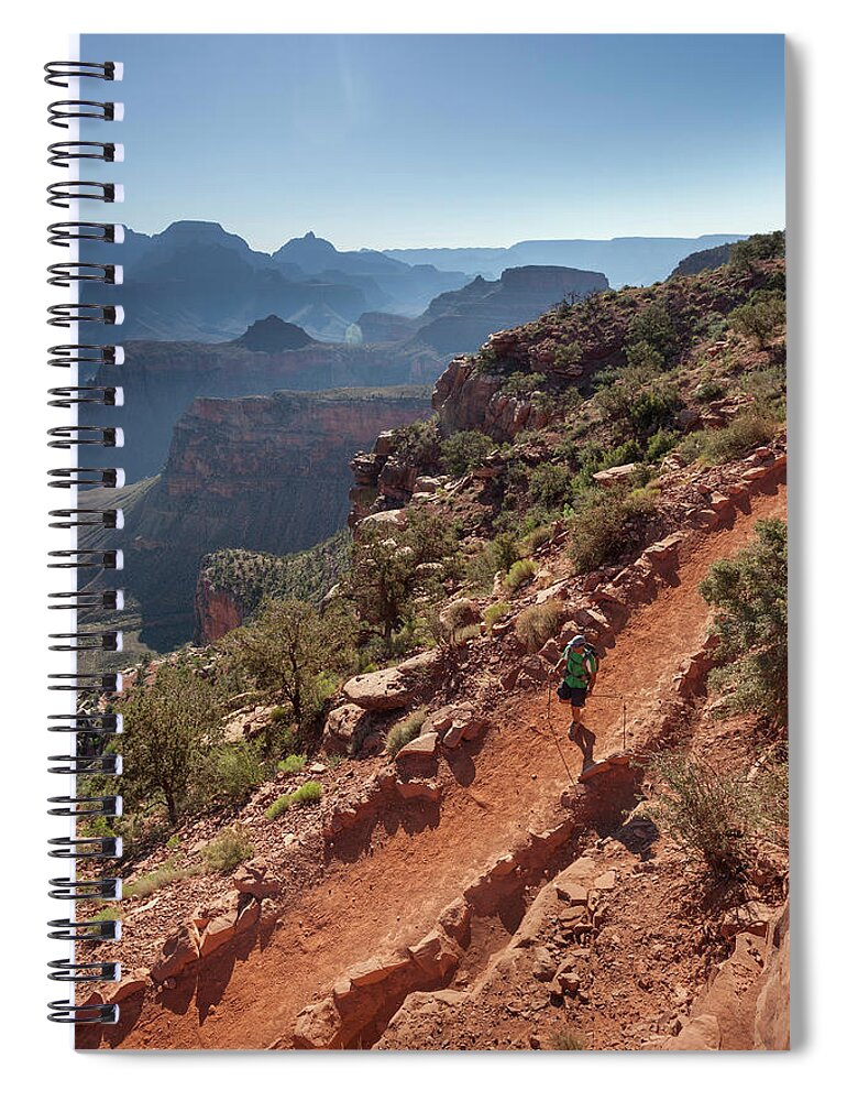 Tranquility Spiral Notebook featuring the photograph A Man Hiking On A Trail With Canyons In by Whit Richardson