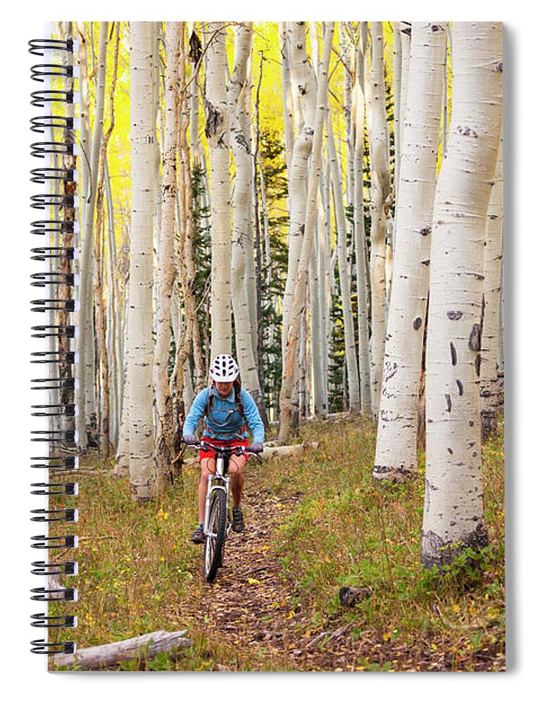 Scenics Spiral Notebook featuring the photograph A Woman Riding A Mountain Bike Through by Whit Richardson