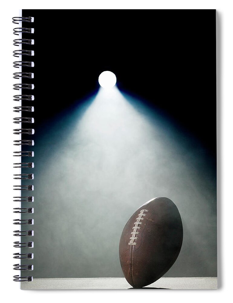 Black Background Spiral Notebook featuring the photograph American Football In Spotlight by Siri Stafford