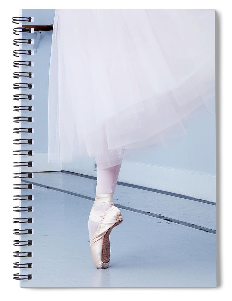 Expertise Spiral Notebook featuring the photograph Ballerina On Pointe Low Angle View by Jonya