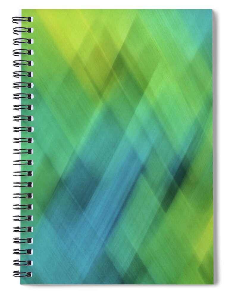 Abstract Spiral Notebook featuring the photograph Bright blue, turquoise, green and yellow blurred diamond shapes and lines abstract by Teri Virbickis