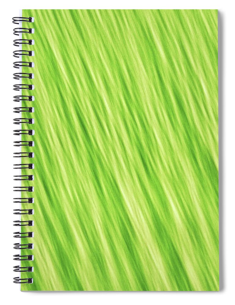 Abstract Spiral Notebook featuring the photograph Bright chartreuse green blurred diagonal lines abstract by Teri Virbickis