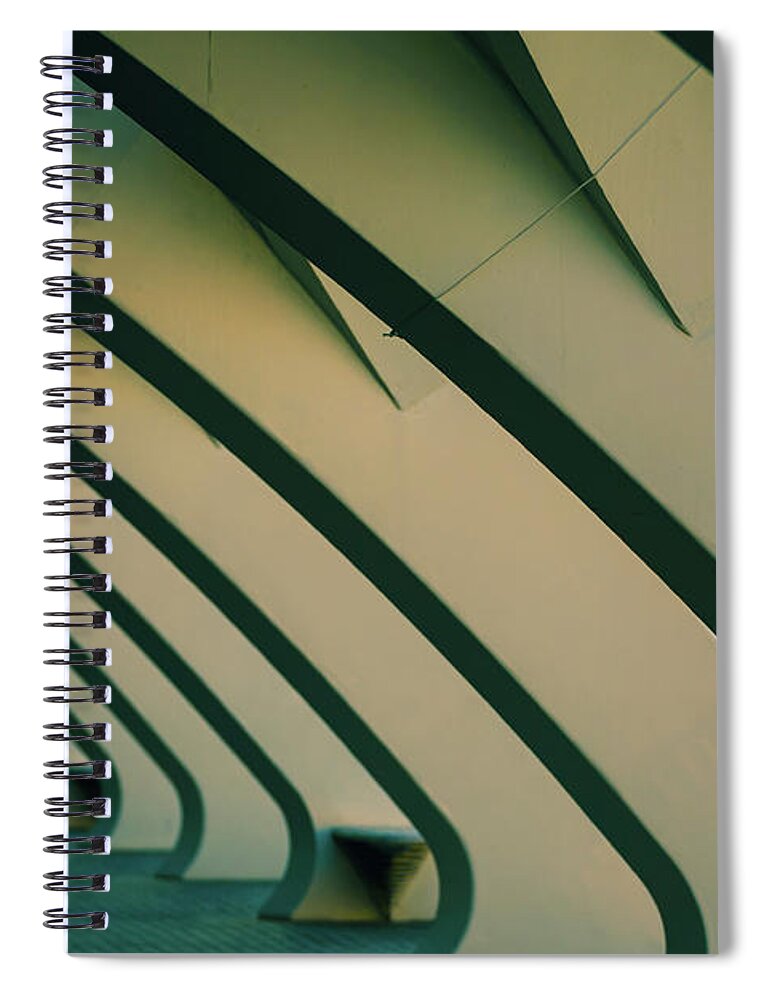 Abstract Spiral Notebook featuring the photograph Columns of white cement in a dark scene, as background of moder by Joaquin Corbalan