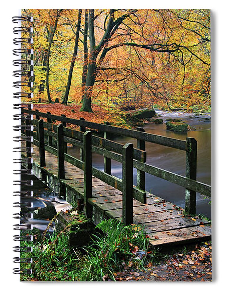 Tranquility Spiral Notebook featuring the photograph Footbridge Over A River In An Autumnal by Simon Butterworth