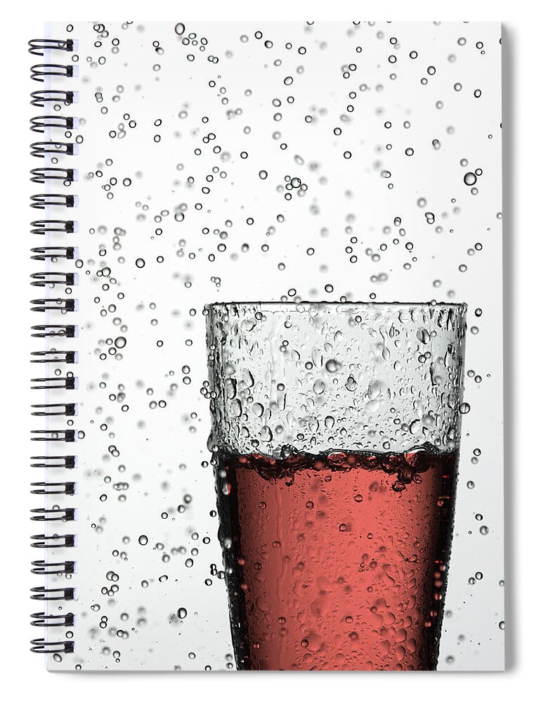 White Background Spiral Notebook featuring the photograph Glass Of Juice In Water Drops by Walter Zerla