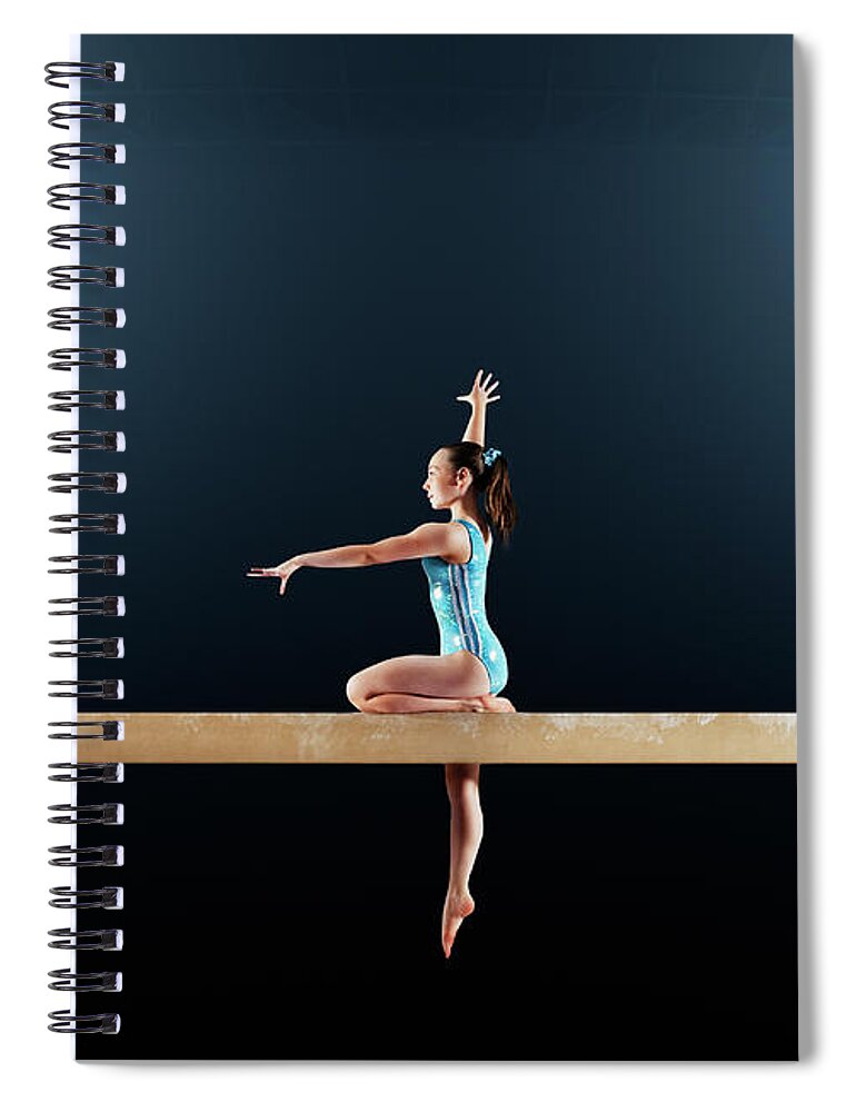 Focus Spiral Notebook featuring the photograph Gymnast Performing Routine On Balance by Robert Decelis Ltd