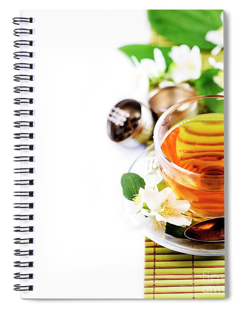 Tea Spiral Notebook featuring the photograph Herbal green tea with jasmine flower in transparent teacup borde by Jelena Jovanovic