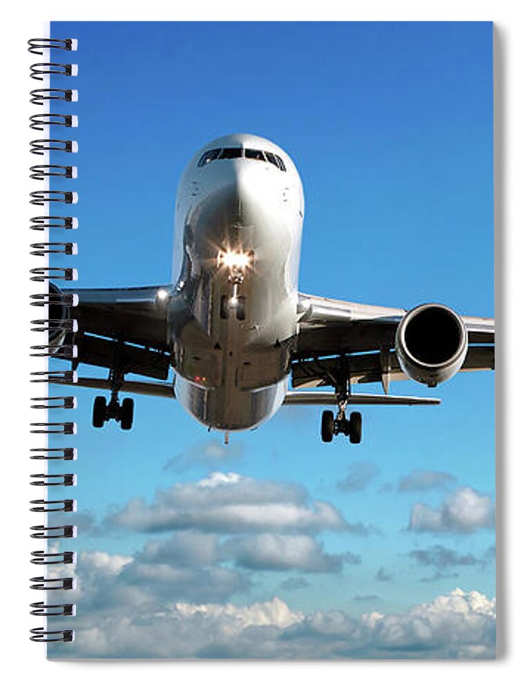 Freight Transportation Spiral Notebook featuring the photograph Jet Airplane Landing In Cloudy Sky by Sharply done
