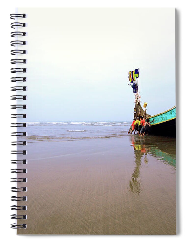 Water's Edge Spiral Notebook featuring the photograph Kids Are Trying To Move Fishing Boat On by Mohammad Mustafizur Rahman