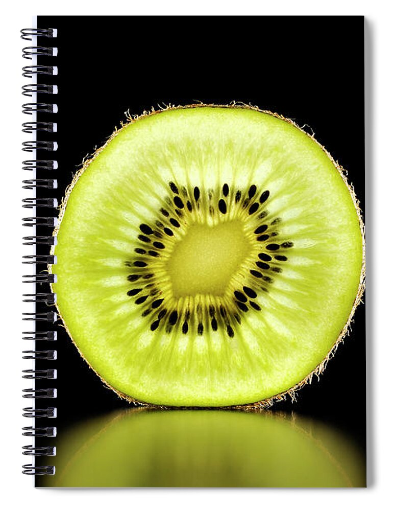 Black Background Spiral Notebook featuring the photograph Kiwi Slice Is Illuminated Black by Yagi Studio
