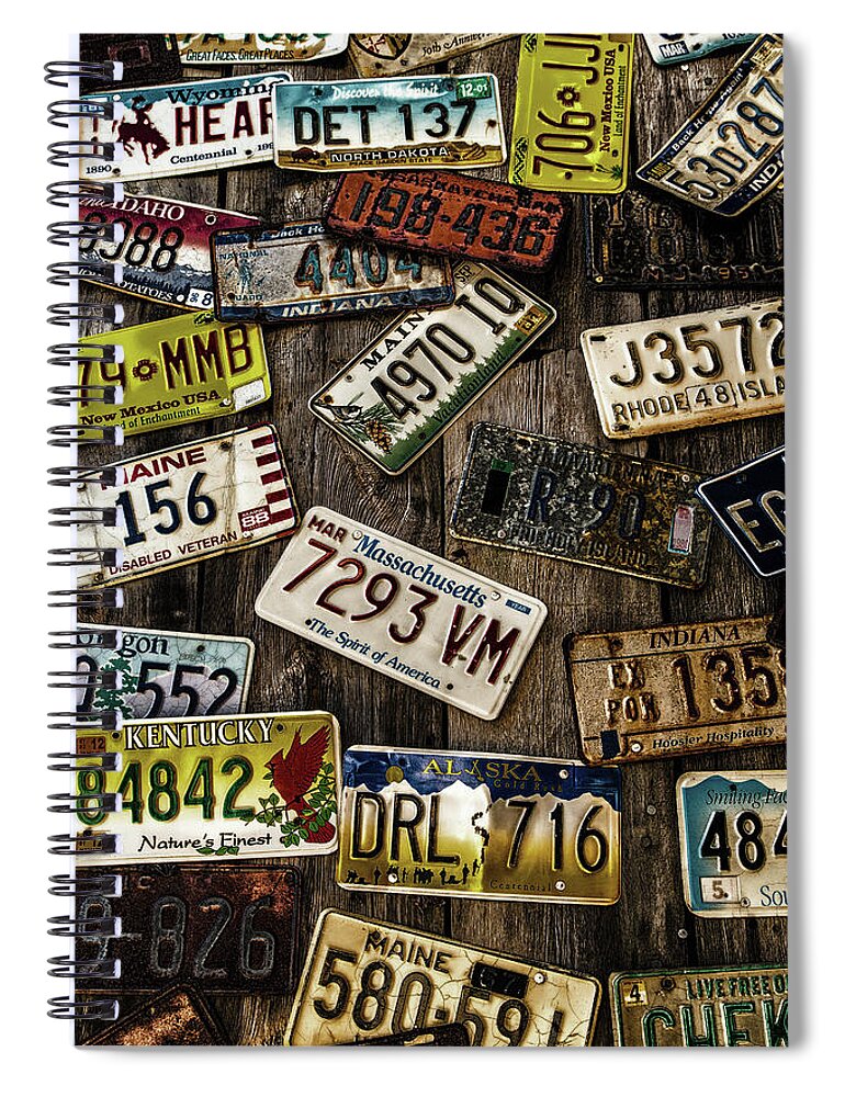Alaska Spiral Notebook featuring the photograph License Plates on Old Wall by Darryl Brooks