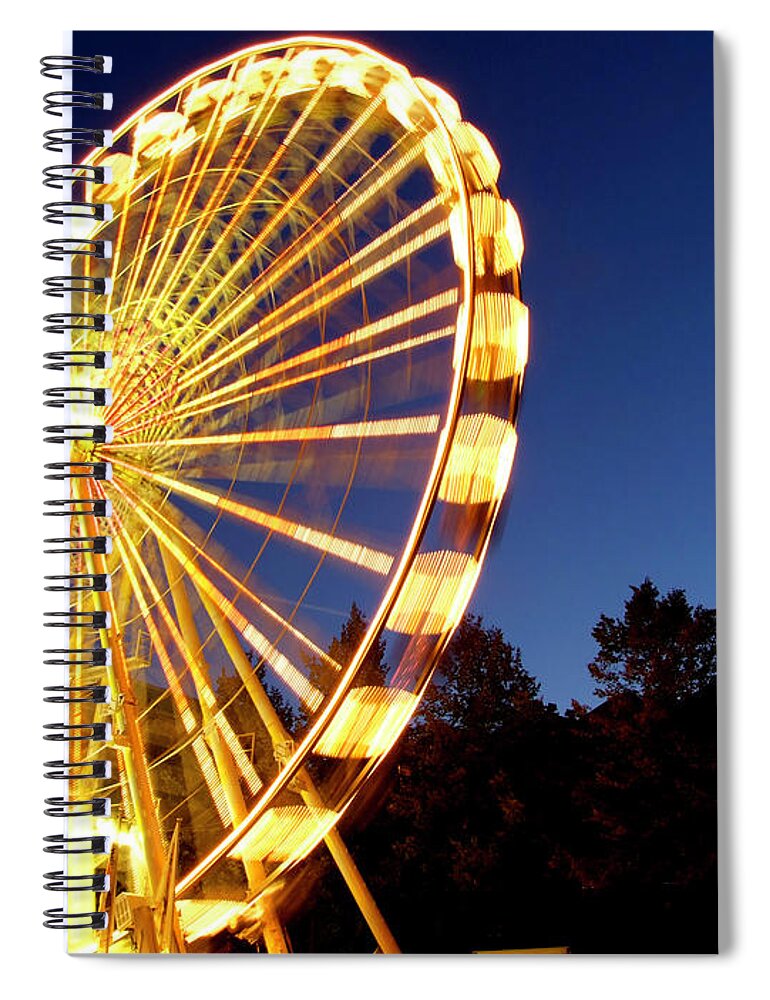 Curve Spiral Notebook featuring the photograph Lighted Ferris Wheel Spinning In Motion by Vfka
