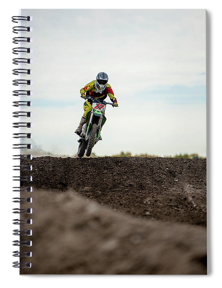 Crash Helmet Spiral Notebook featuring the photograph Low Angle View Of Motocross Racer On by Ascent Xmedia