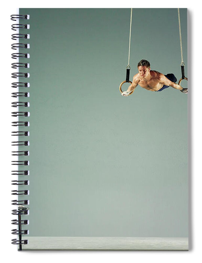 Hanging Spiral Notebook featuring the photograph Male Athlete Practising A Rings Exercise by 10'000 Hours