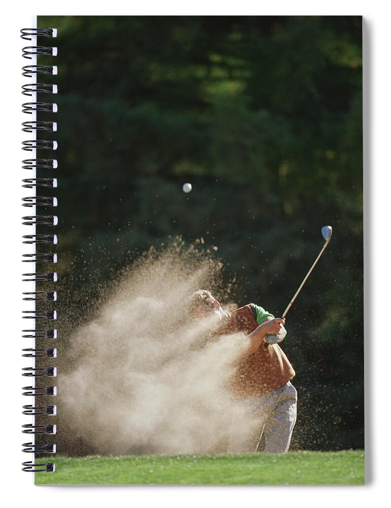 Sand Trap Spiral Notebook featuring the photograph Male Golfer Hitting Out Of A Sand Trap by David Madison