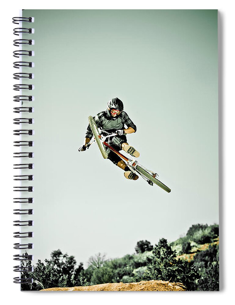 Young Men Spiral Notebook featuring the photograph Man Jumping Mountain Bike In Mid-air by Doug Berry