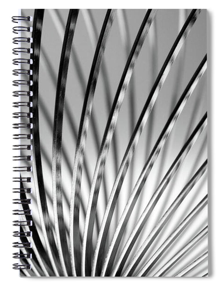 Full Frame Spiral Notebook featuring the photograph Metal Slinky by Deceptive Media