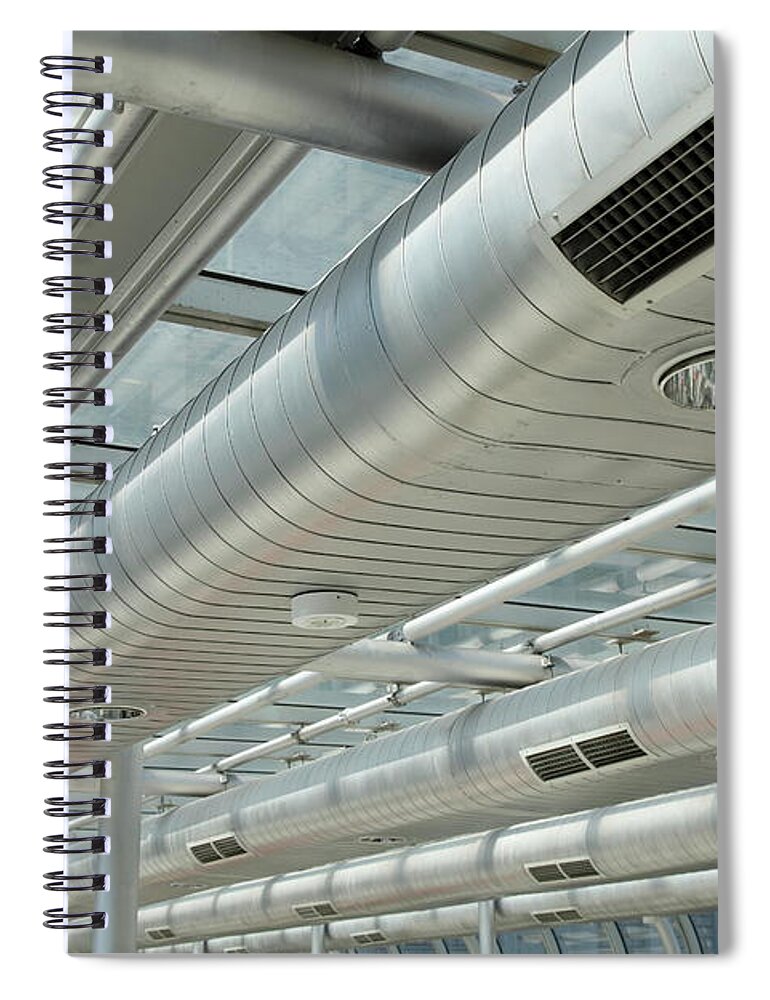 In A Row Spiral Notebook featuring the photograph Metallic, Shiny, Long Air Ducts by Craigrjd