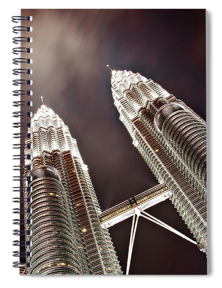 Directly Below Spiral Notebook featuring the photograph Petronas Towers by Smerindo schultzpax