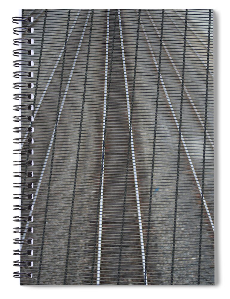 Railroad Track Spiral Notebook featuring the photograph Railroad Tracks Seen Through Metal Fence by Aaron Mccoy