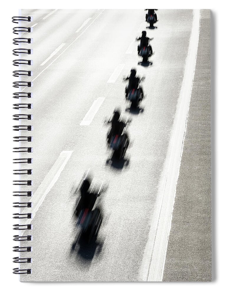 In A Row Spiral Notebook featuring the photograph Rear View Of Row Of Motorcycle Riders by Jorg Greuel