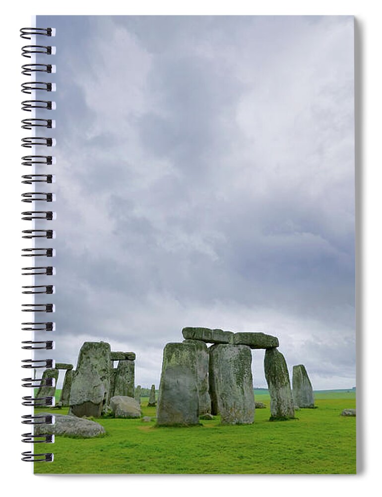 Prehistoric Era Spiral Notebook featuring the photograph Stonehenge And Storm Clouds by John Wang