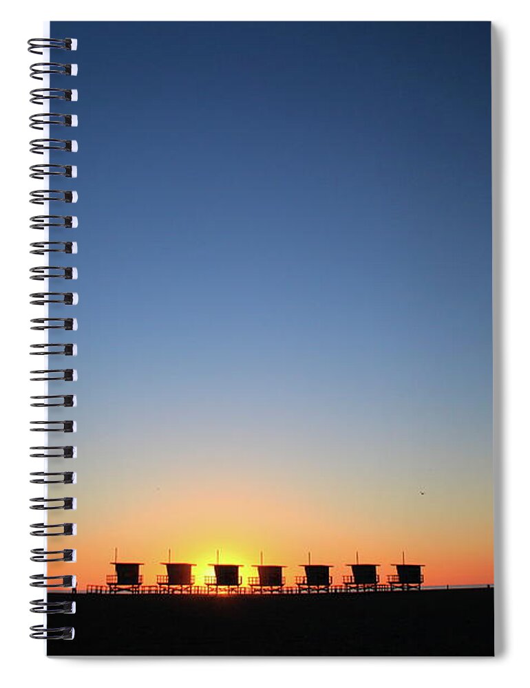 Tranquility Spiral Notebook featuring the photograph Sunset Over Lifeguard Stands by Elizabeth Harvey