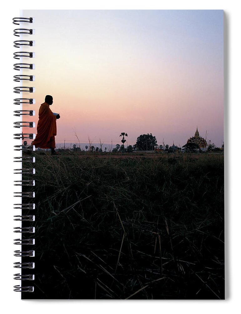 Dawn Spiral Notebook featuring the photograph Thai Monks Returning To Their Temple by Enviromantic