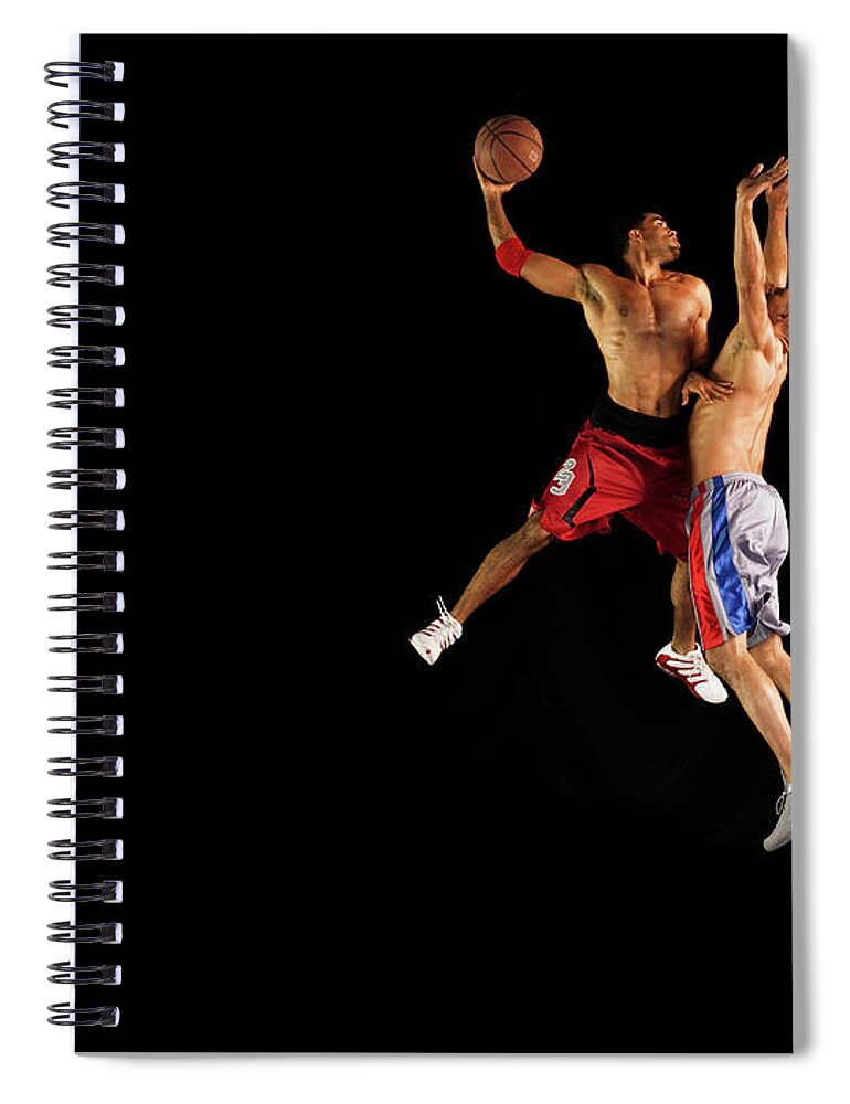 Young Men Spiral Notebook featuring the photograph Two Male Basketball Players Jumping Mid by 10'000 Hours
