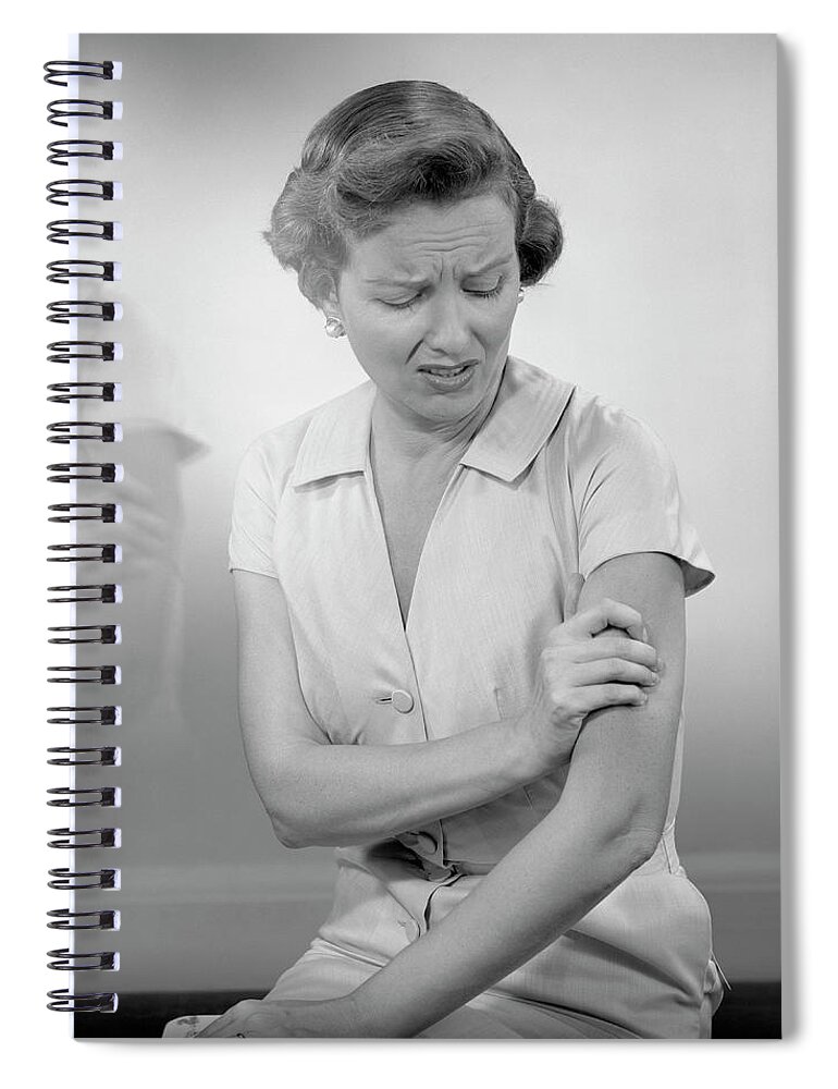 People Spiral Notebook featuring the photograph Woman Massaging Arm by George Marks