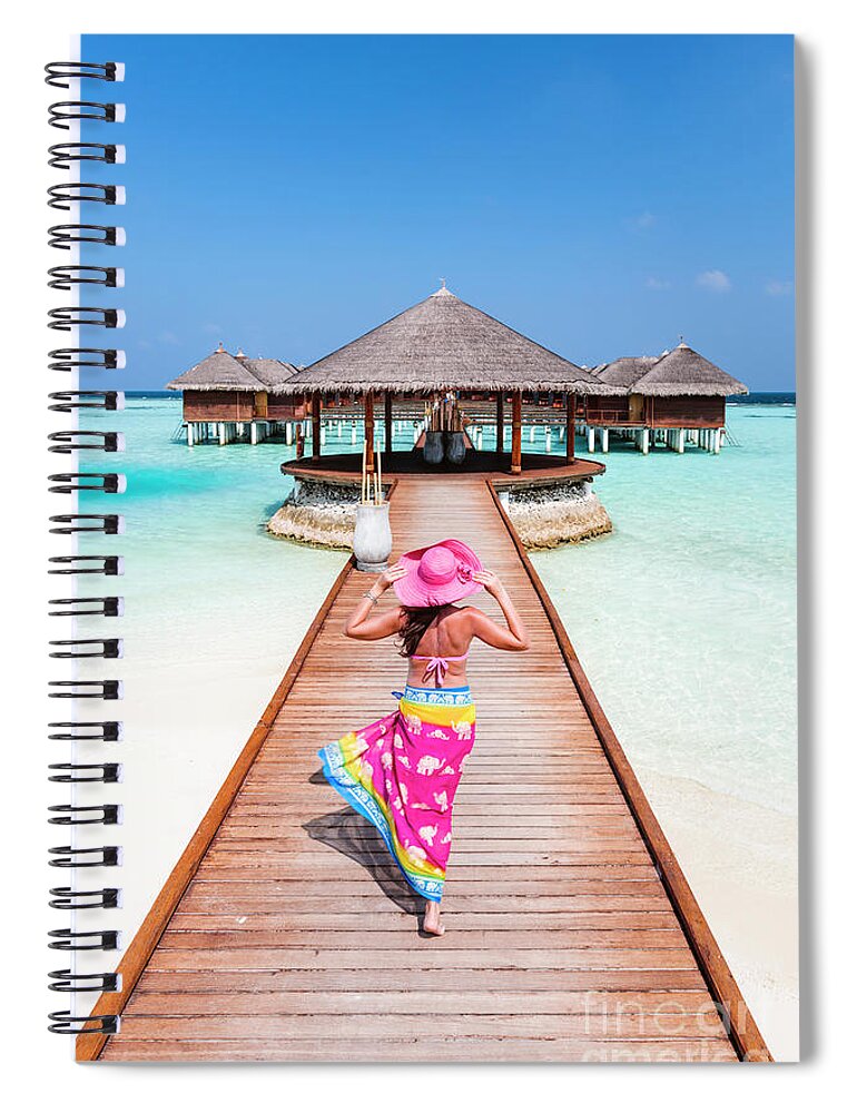 Woman Spiral Notebook featuring the photograph Woman with sarong walking on jetty, Maldives by Matteo Colombo