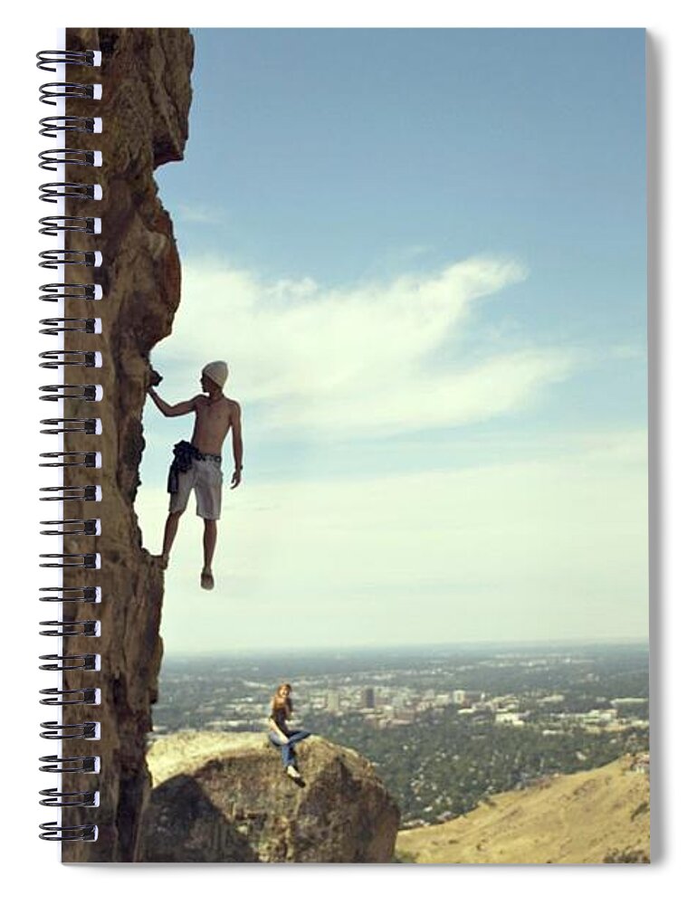 Young Men Spiral Notebook featuring the photograph Young Man Climbs While Girl Looks On by Marit Photography