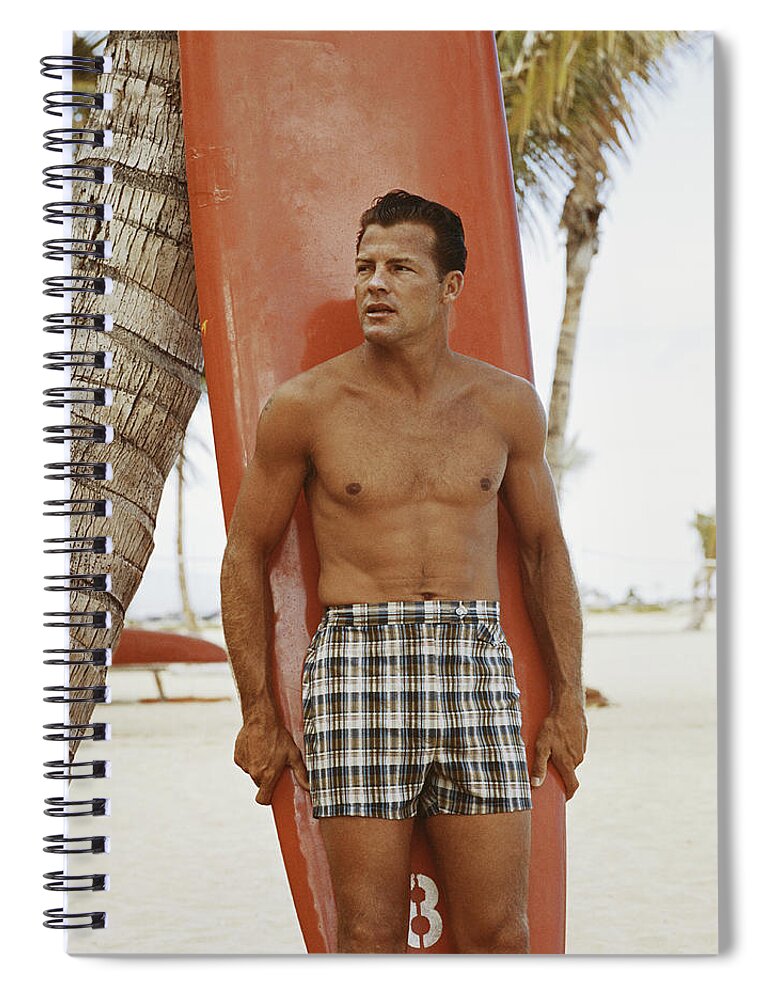 Three Quarter Length Spiral Notebook featuring the photograph Young Man Holding Surfboard On Beach by Tom Kelley Archive