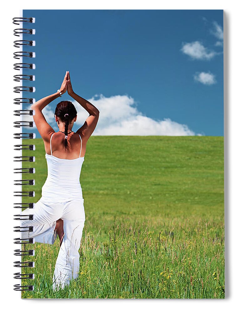 Scenics Spiral Notebook featuring the photograph Young Woman Practicing Yoga by Hadynyah