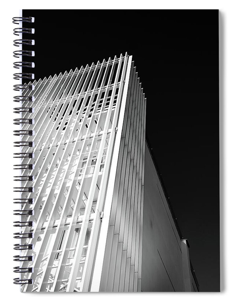 Architecture Spiral Notebook featuring the photograph Abstract architecture design. Black and white futuristic exterior background. Black sky copy-space by Michalakis Ppalis