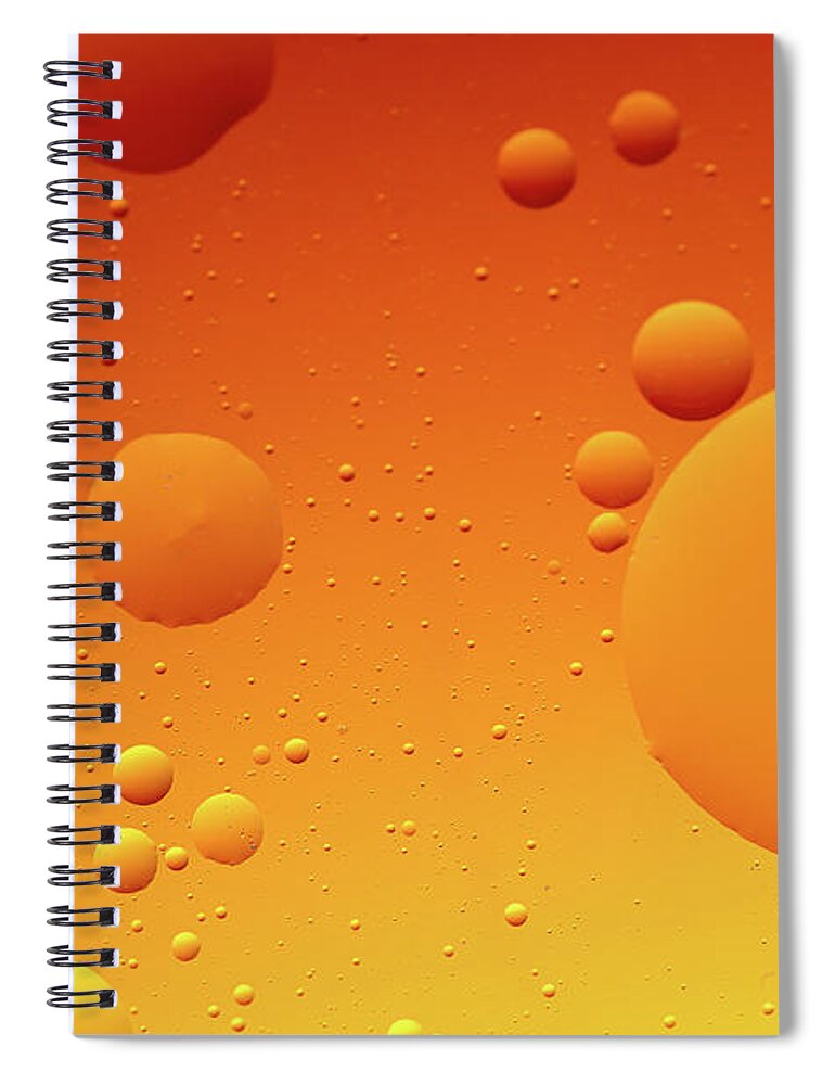 Connection Spiral Notebook featuring the photograph Bright abstract, yellow background with flying bubbles by Michalakis Ppalis