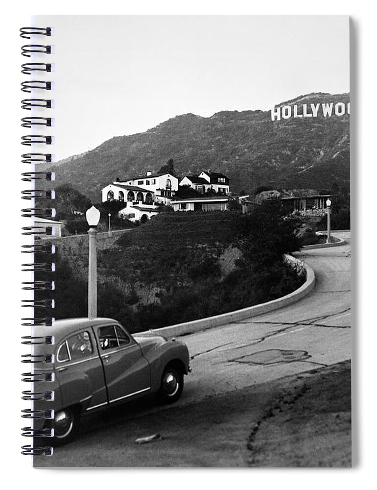B&w Black And White 1950s America Austin Auto Automobile Autos California Car Cars City Communicate Communicating Communication Community Distance Drive Driving Highway Hills Historic Historical History Hollywood Hills Hollywood Sign Hollywood Los Angeles Outdoors Road Roads Scenic Sign Street Lamp Suburban Transportation Travel United States Of America United States Urban Urban Center Usa Vehicle Vehicles West Coast Retro Vintage Nostalgia Nostalgic Old Fashioned Old Fashion Old Time Classic Spiral Notebook featuring the photograph 1950s Austin car driving up the Hollywood Hills with Hollywood sign in distance Los Angeles CA USA by Panoramic Images