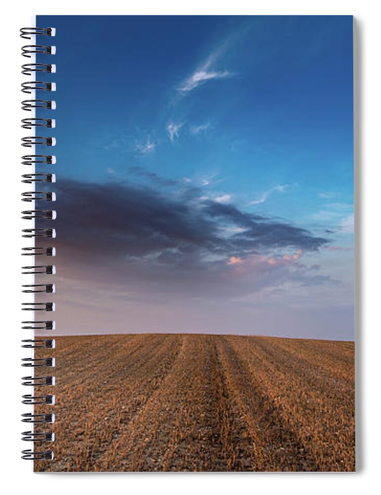 Nightfall Spiral Notebook featuring the photograph Agricultural meadow field and cloudy sky during sunset. by Michalakis Ppalis