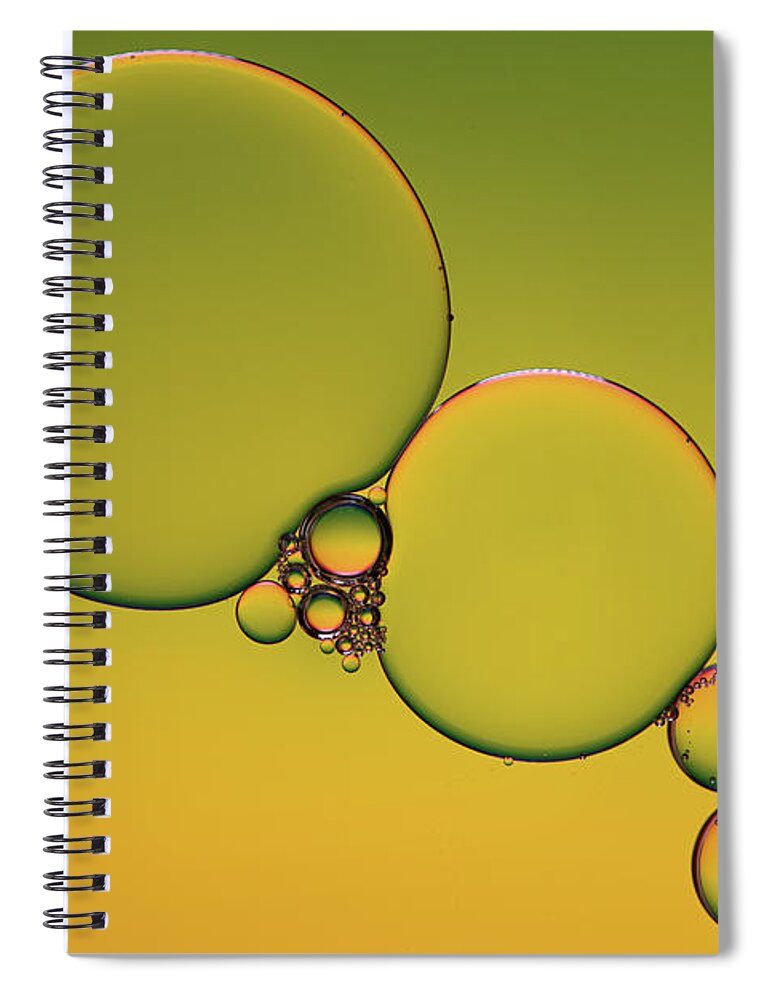 Connection Spiral Notebook featuring the photograph Bright abstract, yellow background with flying bubbles by Michalakis Ppalis