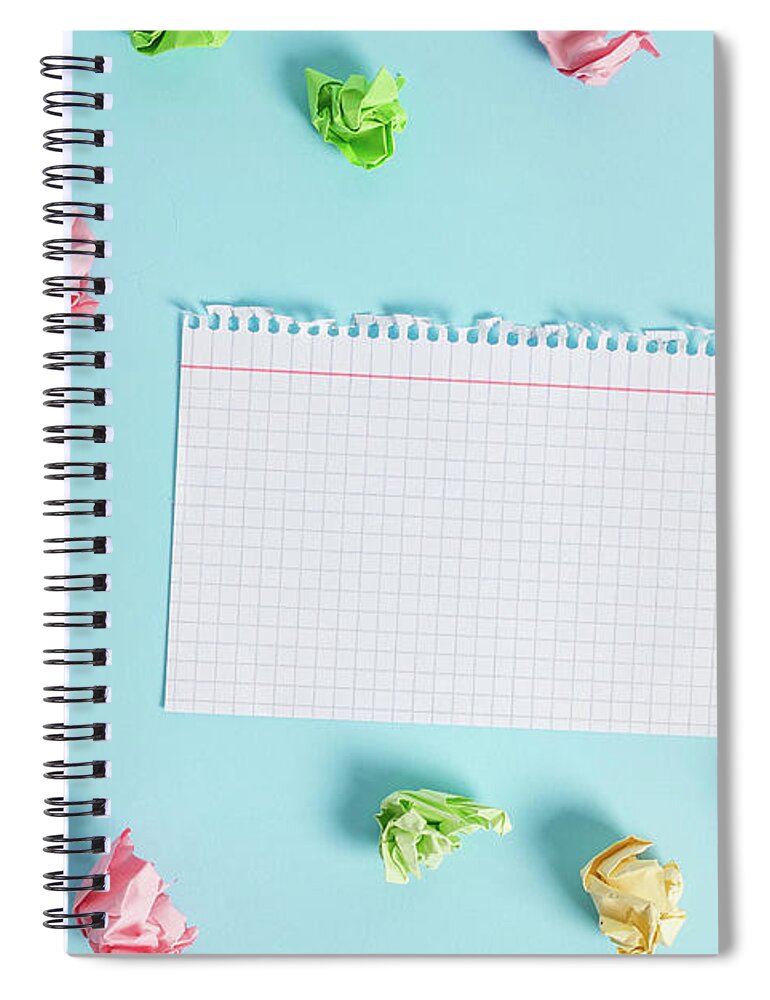 Rectangle square shaped colored paper in a light blue background. Colorful  crumpled note spread around the table. Reminder in a blank space. Office  supplies in a desk. #5 Spiral Notebook by Artur