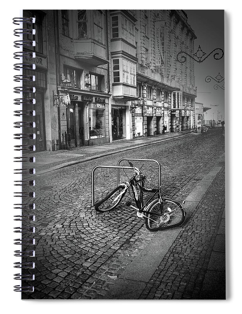 Leipzig Spiral Notebook featuring the photograph A Broken Bicycle in Leipzig Germany by James C Richardson