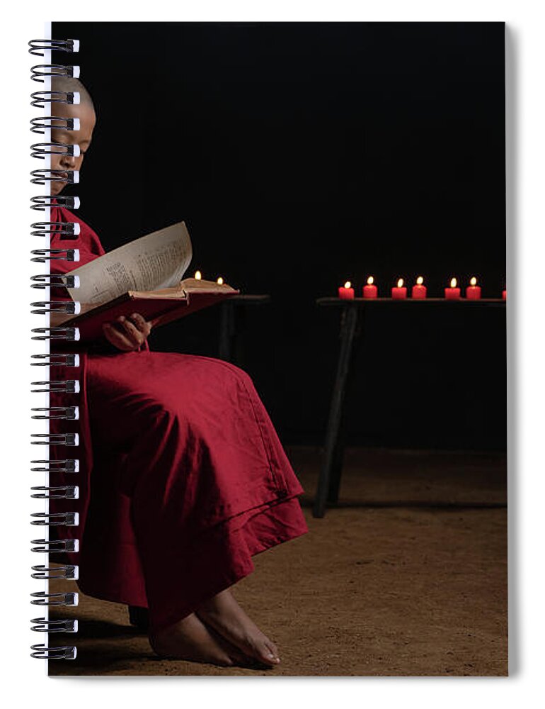 Novice Spiral Notebook featuring the photograph A novice monk reading by Anges Van der Logt
