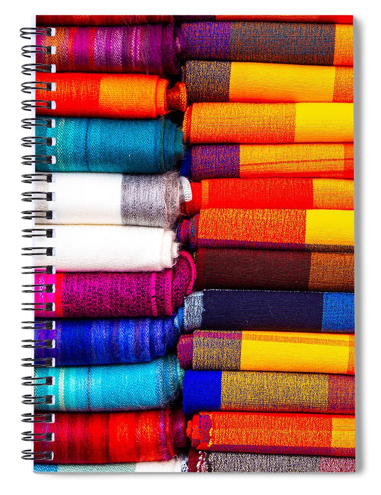 Color Spiral Notebook featuring the photograph A Stack of blankets for sale at the Otavalo Market in Ecuador by L Bosco
