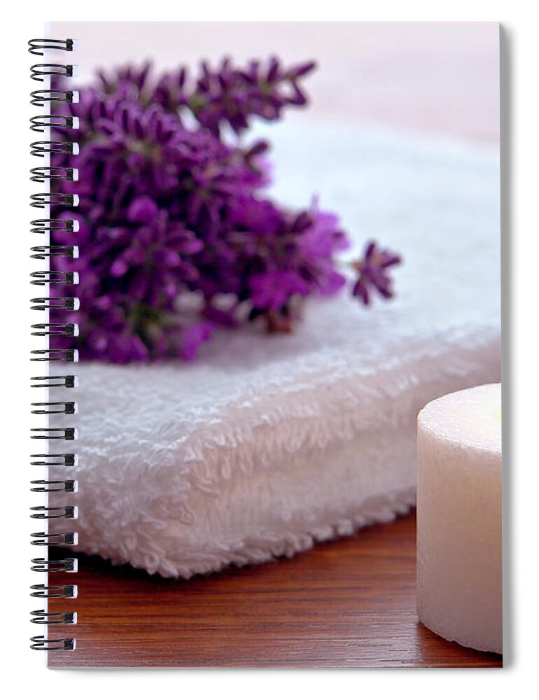 Aromatherapy Spiral Notebook featuring the photograph Aromatherapy Candle with Lavender Flowers on White Bath Towel in by Olivier Le Queinec