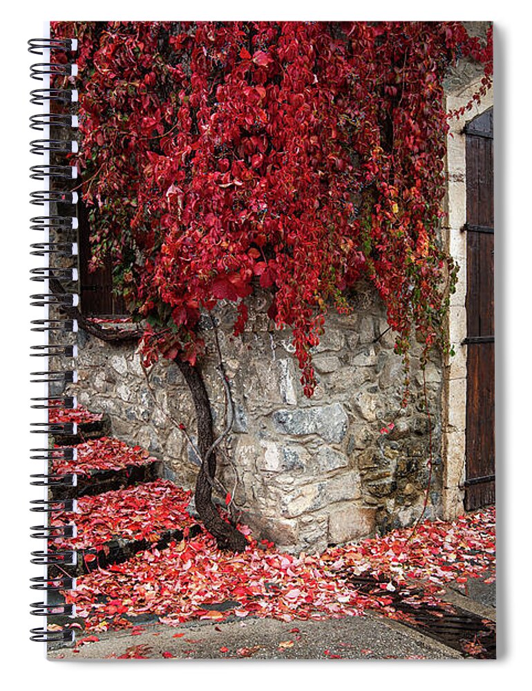 Autumn Spiral Notebook featuring the photograph Autumn landscape with red plants on a hous wall by Michalakis Ppalis