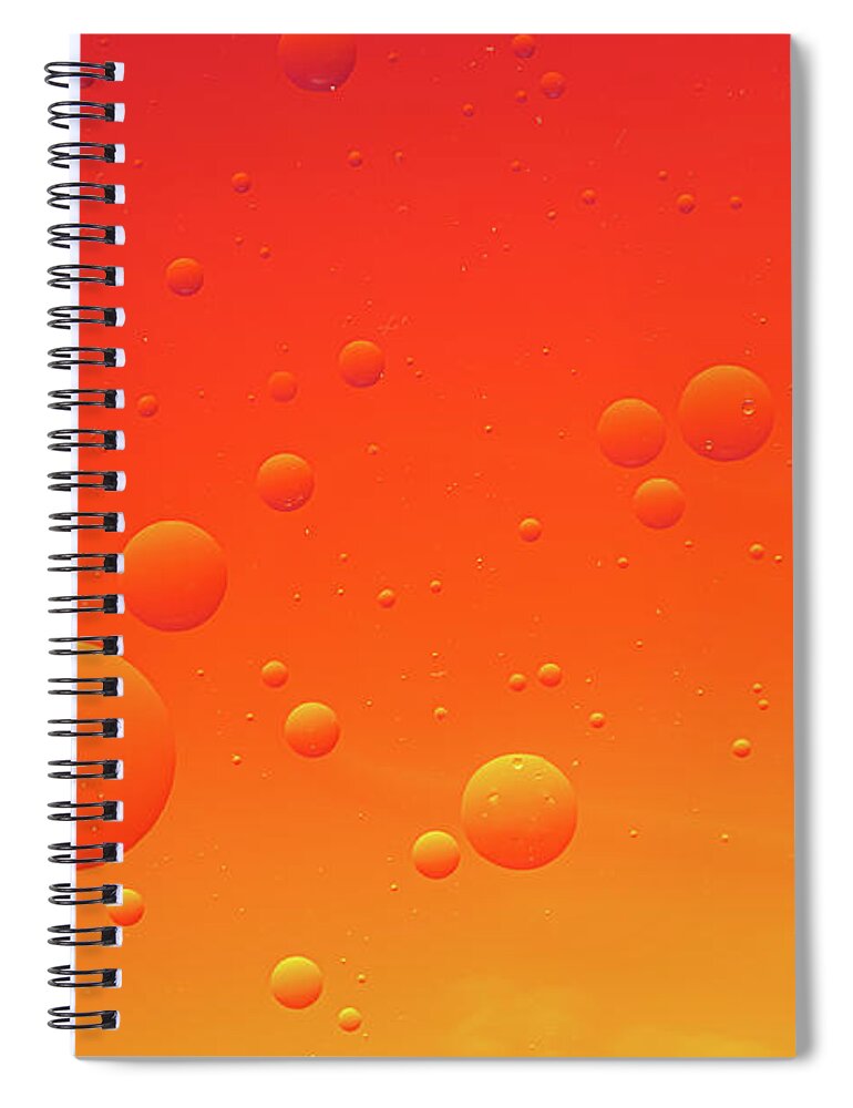 Abstract Spiral Notebook featuring the photograph Bright abstract, red background with flying bubbles by Michalakis Ppalis
