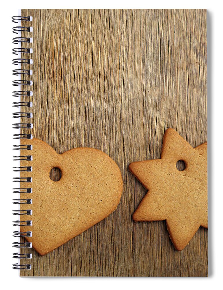 Christmas Spiral Notebook featuring the mixed media Christmas gingerbread cookie over wooden table by Mikhail Kokhanchikov