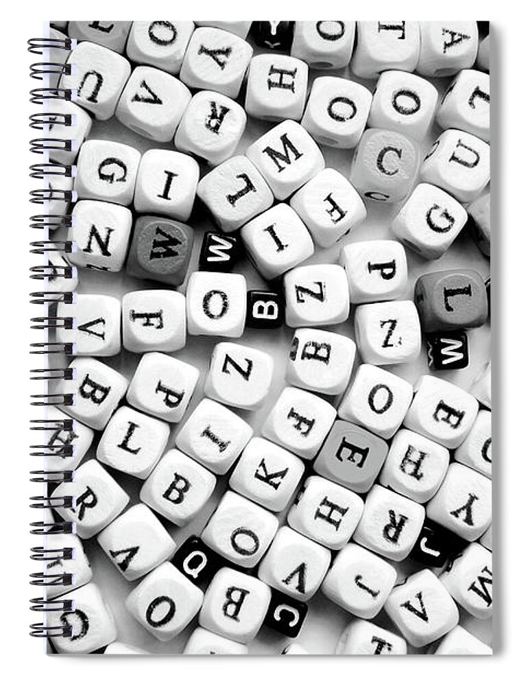 Different Spiral Notebook featuring the photograph Closeup Of The Black And White Various Letters by Severija Kirilovaite