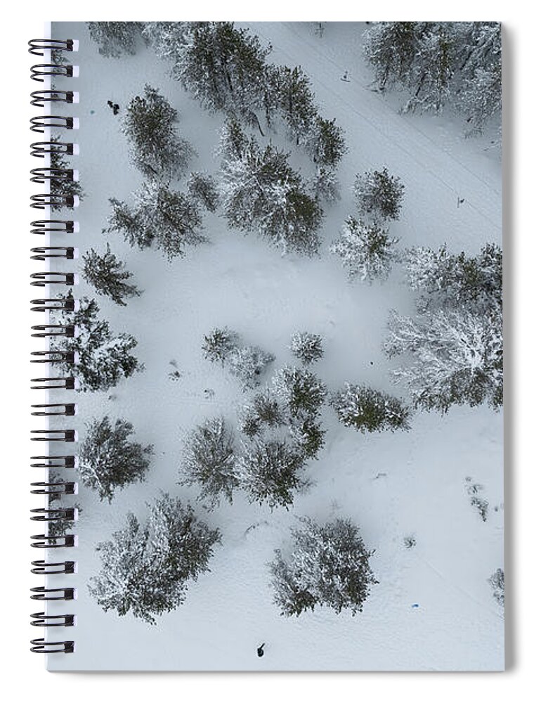 Winter Spiral Notebook featuring the photograph Drone aerial scenery of mountain snowy forest and people playing in snow. Wintertime season by Michalakis Ppalis