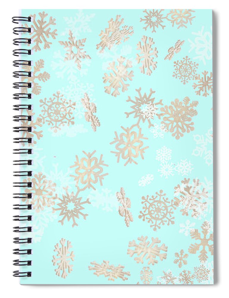 Falling Snowflakes Spiral Notebook featuring the photograph Falling snowflakes pattern on blue background by Simon Bratt